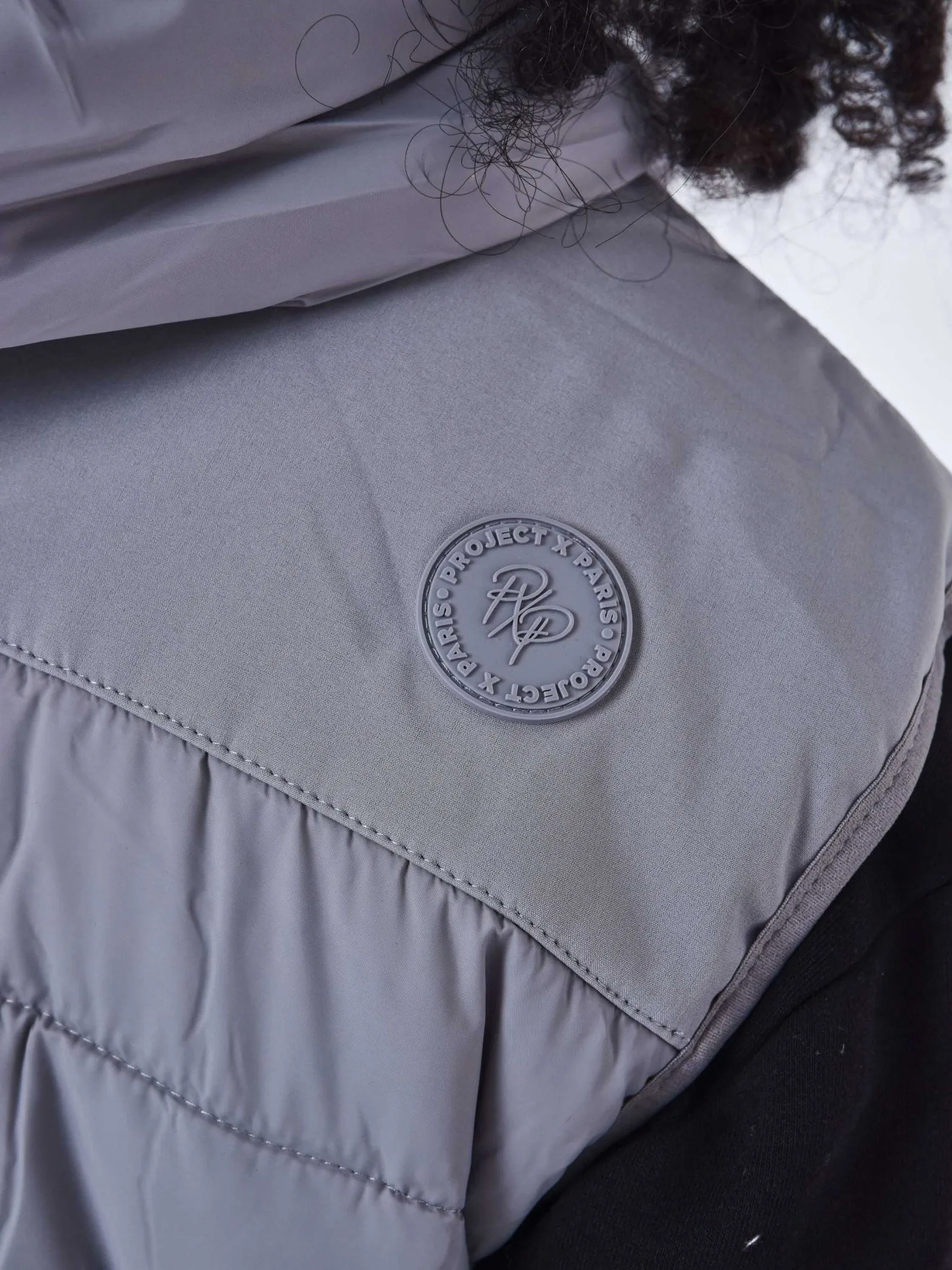 Chaqueta de plumón sin mangas bimateria