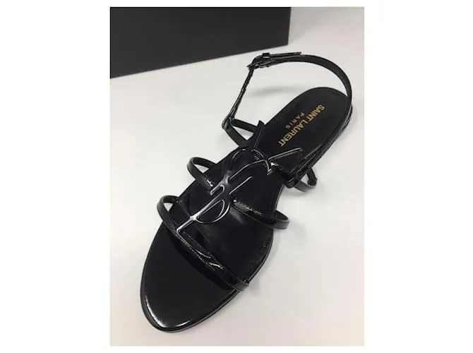 Saint Laurent Sandalias Cassandra en charol con logo Negro 